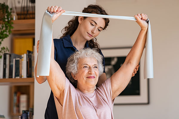 senior woman exercising with help